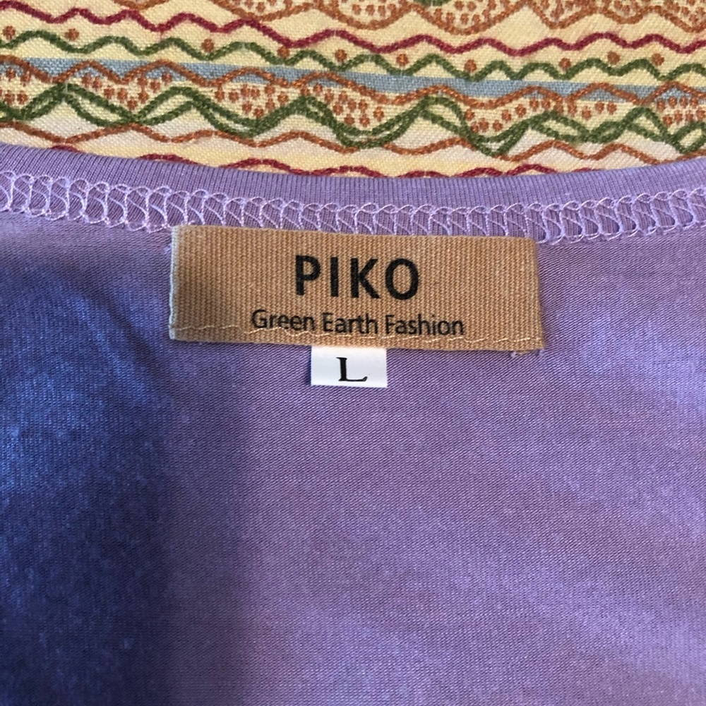 Purple short sleeve Piko top